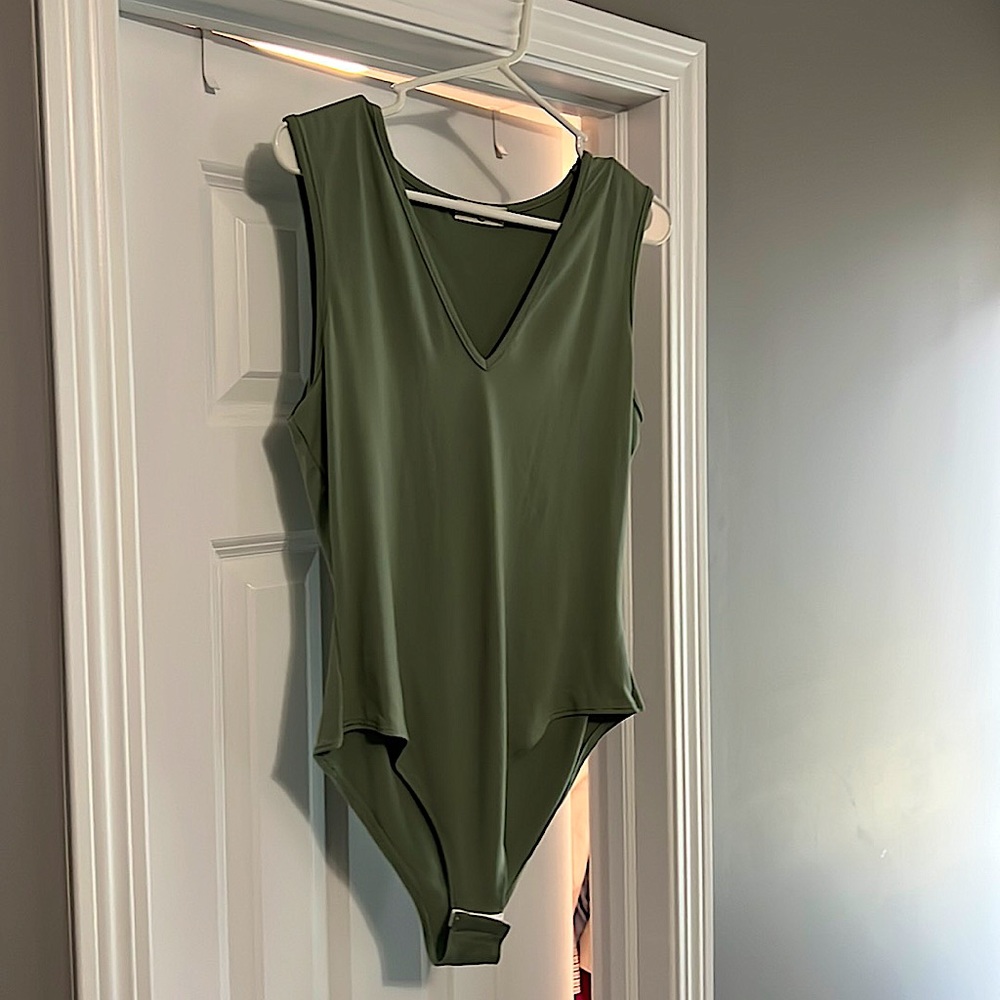 NWOT V neck bodysuit tank. Super soft 96%polyester 4%spandex. Great condition.